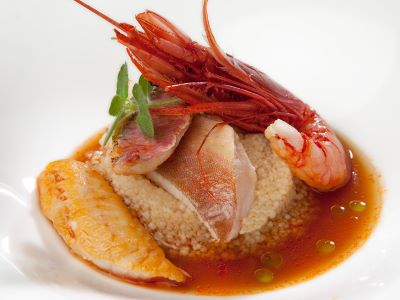 Zuppa di pesce di scoglio con zoccolo di cous cous di frumento timilia all’olio di tonda iblea