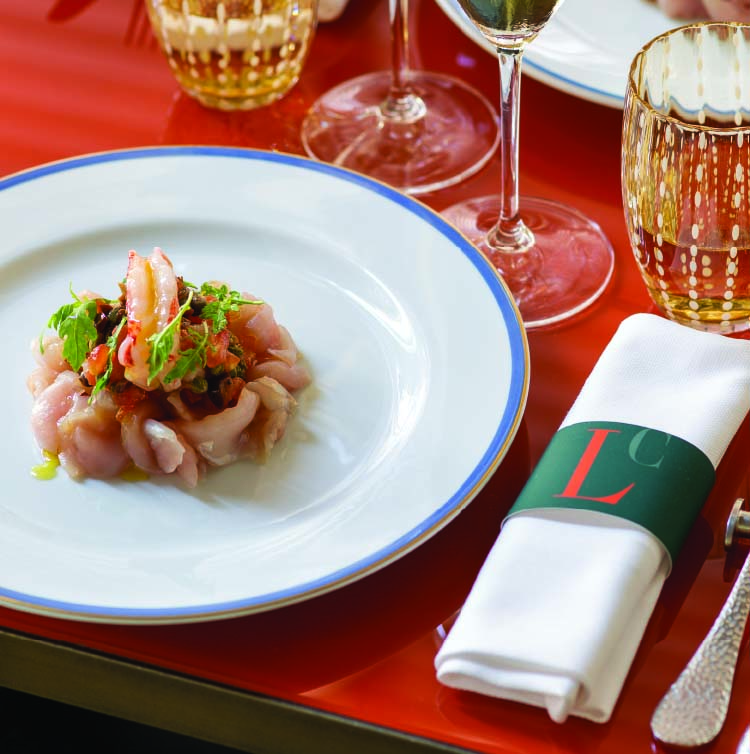 Carpaccio di ricciola con gamberi alla puttanesca